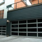 Modern Garage Door with Clear Anodized Aluminum and Clear Tempered Glass